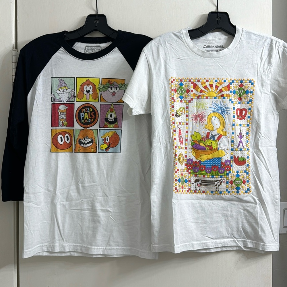 Two XS Meow Wolf shirts